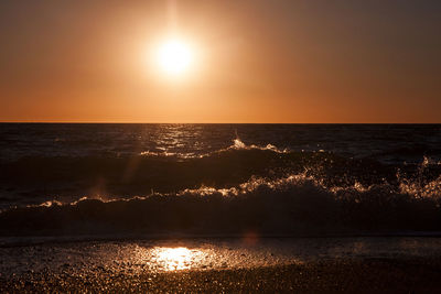 Scenic view of sea against sky at sunset