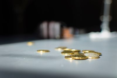 Close-up of coins on table