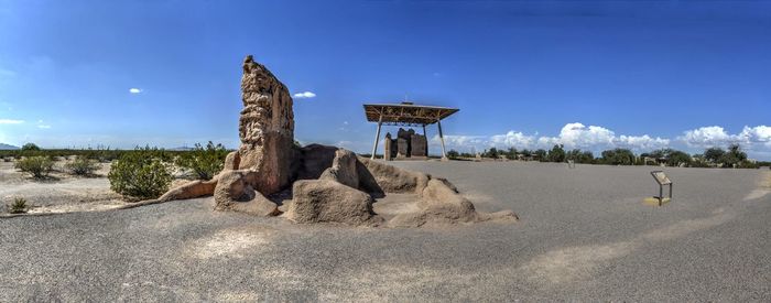 Panoramic view of rocks on land against sky