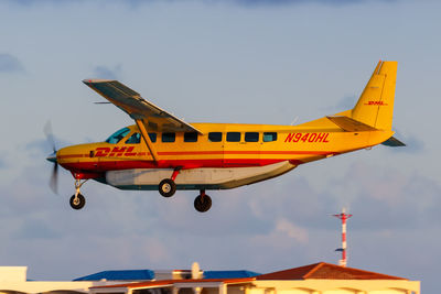 Airplane flying against sky