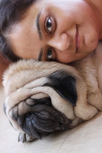 Close-up portrait of woman with dog