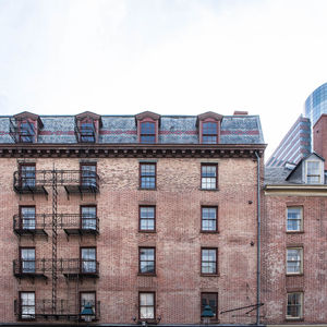 Buildings in city against sky