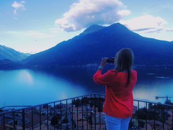 Woman standing in front of mountains