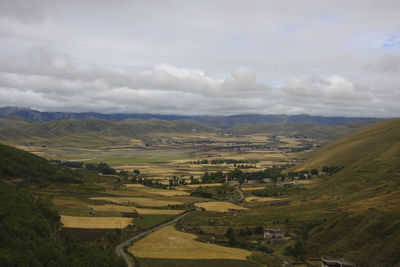 Scenic view of agricultural landscape against sky