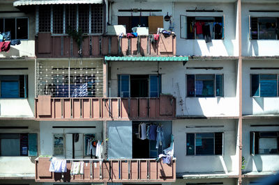 Group of people against building