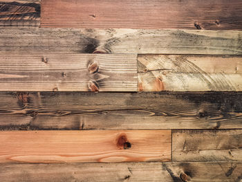 Full frame shot of cat sleeping on wood