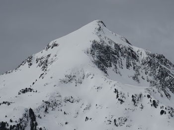 Scenic view of snow covered mountains against sky