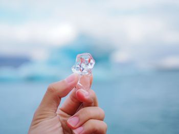 Close-up of person holding ice