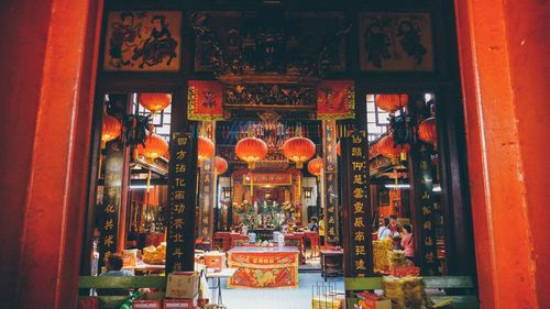 Illuminated lanterns hanging outside building