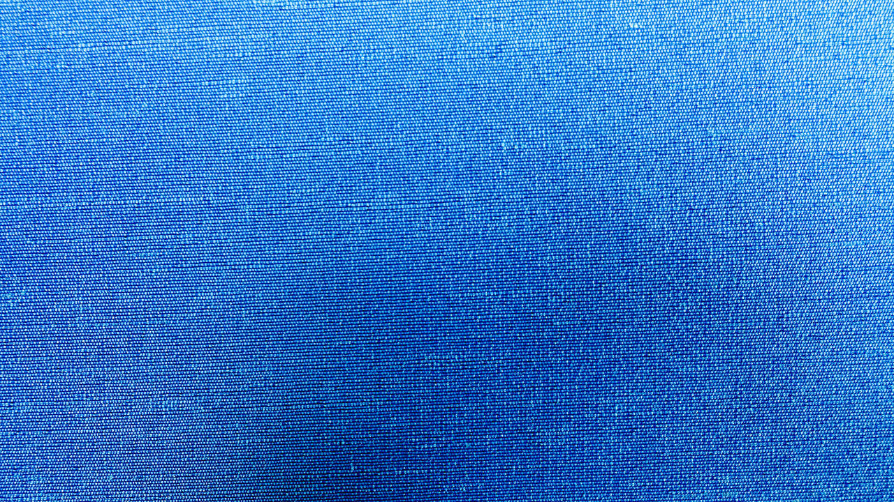 FULL FRAME SHOT OF BLUE PATTERN ON TEXTURED SURFACE