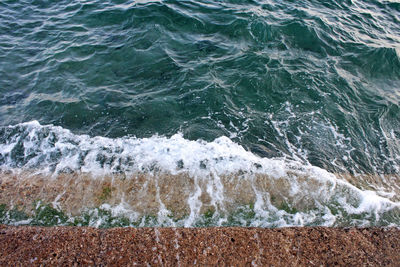 Sea waves splashing on rocks