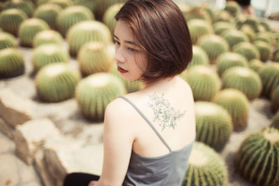 Side view of young woman looking down
