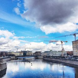 View of harbor against cloudy sky