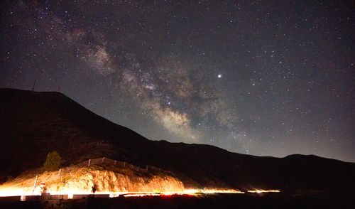 Scenic view of star field against sky at night