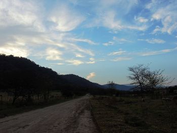 Empty road along landscape