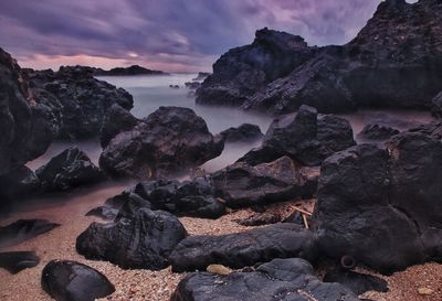 Scenic view of sea against dramatic sky