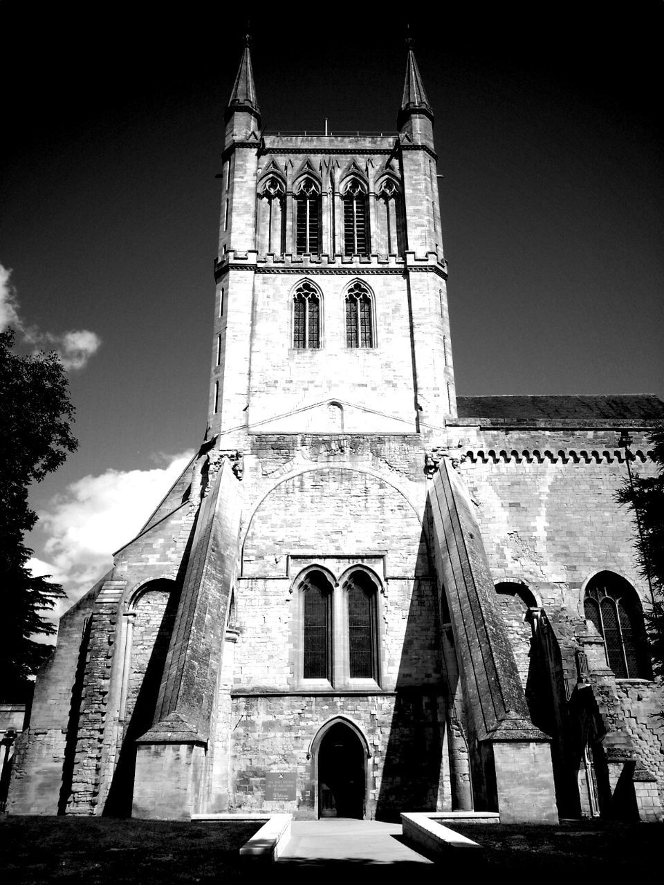 architecture, built structure, building exterior, low angle view, church, religion, place of worship, sky, arch, spirituality, facade, history, tower, window, travel destinations, cathedral, famous place, day