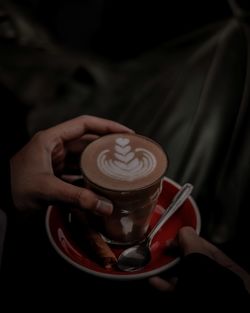 Hand holding coffee cup