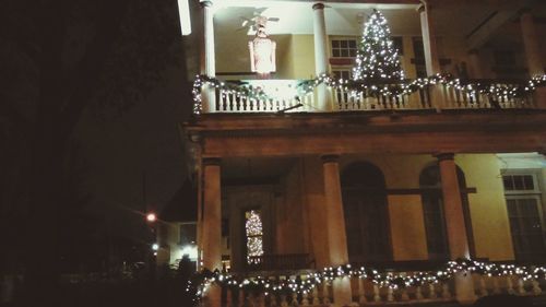 Low angle view of illuminated lights at night