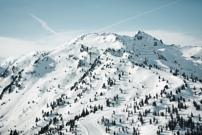 High angle view of snow covered mountains against sky