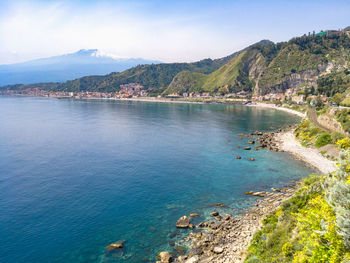 High angle view of bay and sea against sky