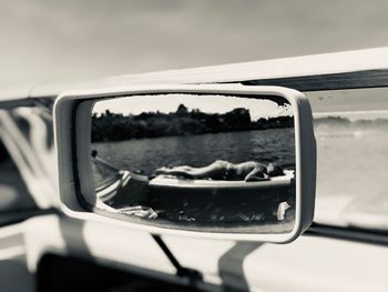 Close-up of side-view mirror of car