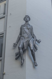 Low angle view of statue against building