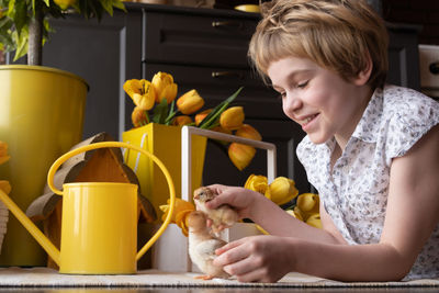 Side view of boy preparing food at home