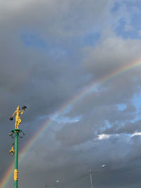 Low angle view of rainbow against sky