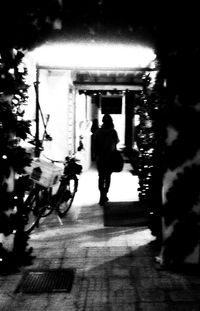 Full length of woman standing on railing