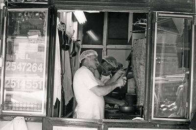 Man working on glass window