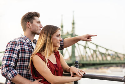 Close-up of couple against sky