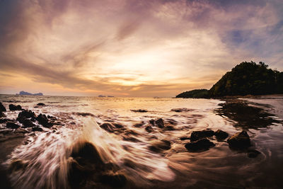 Scenic view of sea against dramatic sky