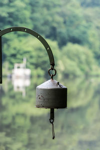 Metal bell hanging against mountain