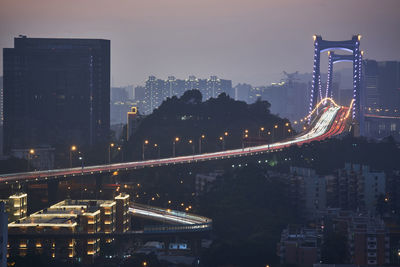 High angle view of illuminated buildings against sky at night