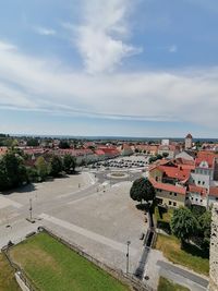 High angle view of street amidst buildings against sky