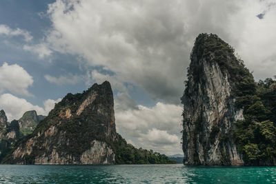 Panoramic view of sea and mountains against sky