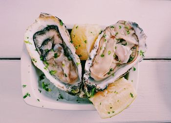 Close-up of oysters in plate on table