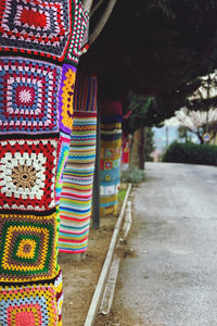 Close-up of multi colored umbrellas on table