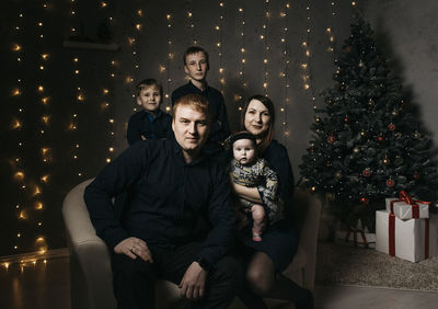 Portrait of family at home during christmas