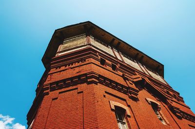 Low angle view of historical building against clear blue sky