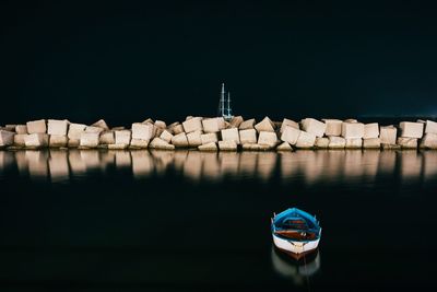 Boat in lake against clear sky