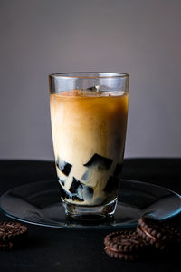 Close-up of coffee in glass on table