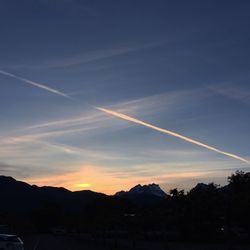 Scenic view of mountains against sky at sunset