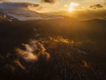 Scenic view of mountains against sky during sunset