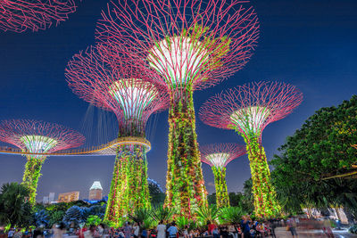 Low angle view of firework display at night