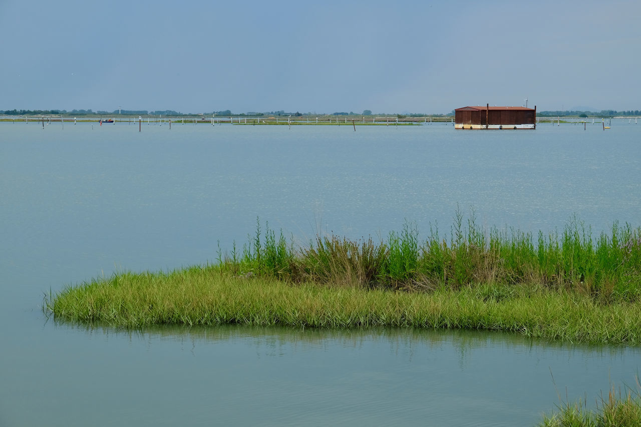 SCENIC VIEW OF LAKE BY LANDSCAPE AGAINST SKY