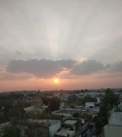 High angle view of buildings against sky during sunset