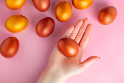 Cropped hand of woman holding easter egg