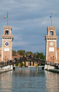 View of clock tower amidst buildings against sky